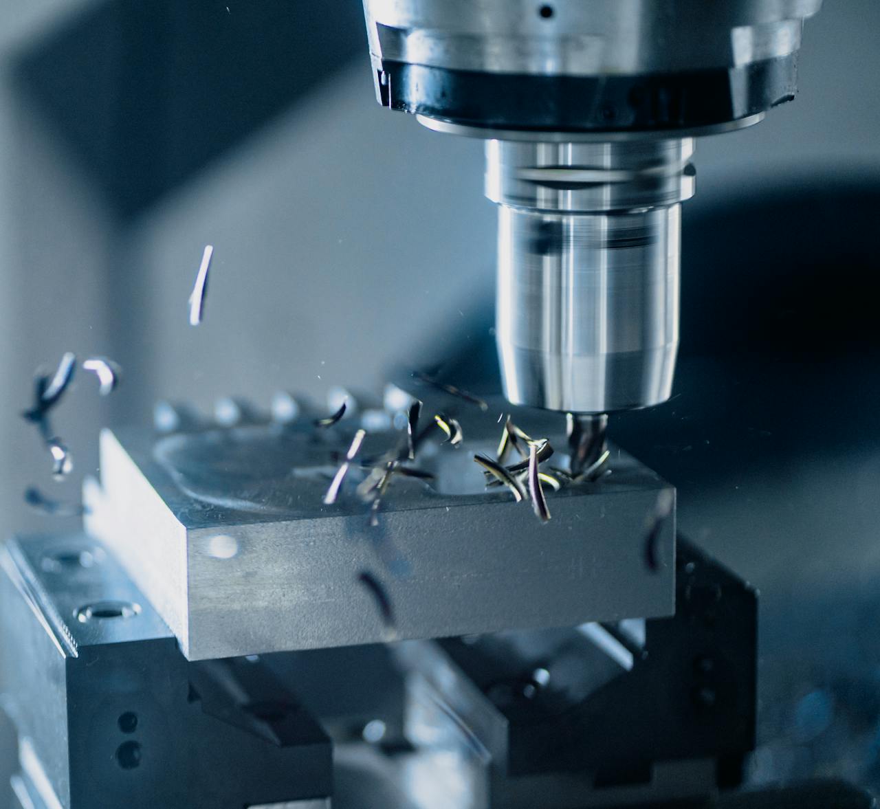 why-choose-us Close-up of a CNC milling machine working on metal for precise manufacturing.